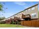 Exterior view of modern townhomes with private wooden decks and well-maintained green lawn under a blue sky at 833 Charles Bank Se Ave, Atlanta, GA 30312