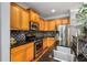 Well-equipped kitchen with stainless steel appliances, wooden cabinets, and granite countertops at 833 Charles Bank Se Ave, Atlanta, GA 30312