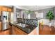 Well-equipped kitchen with stainless steel appliances, eat-in bar, and modern lighting at 833 Charles Bank Se Ave, Atlanta, GA 30312