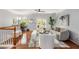 Open loft area with hardwood floors, gray walls, and a ceiling fan at 833 Charles Bank Se Ave, Atlanta, GA 30312