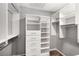 Bright, walk-in closet features shelving, storage, and a closet rod at 833 Charles Bank Se Ave, Atlanta, GA 30312