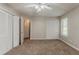 Spacious bedroom featuring a closet, a window and carpet flooring at 964 Chapman Ln, Stone Mountain, GA 30088