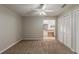 Bedroom featuring plush carpet, ceiling fan, and a view of the adjacent bathroom at 964 Chapman Ln, Stone Mountain, GA 30088