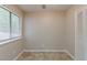 This bedroom has tile floor, a window with blinds, and a closet with folding doors at 964 Chapman Ln, Stone Mountain, GA 30088