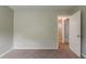 Bedroom featuring a view of the doorway, neutral wall paint, and carpet flooring at 964 Chapman Ln, Stone Mountain, GA 30088