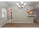 The dining area includes views of a hallway, breakfast bar, and window with natural lighting at 964 Chapman Ln, Stone Mountain, GA 30088