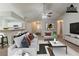 Bright, virtually staged living room features a ceiling fan, modern furniture, and neutral tones at 964 Chapman Ln, Stone Mountain, GA 30088