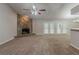 Expansive living room with a stone fireplace and three sets of French doors provides ample natural light at 964 Chapman Ln, Stone Mountain, GA 30088