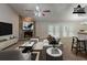 The virtually staged living room has a stone fireplace, French doors, and modern decor at 964 Chapman Ln, Stone Mountain, GA 30088