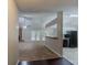 Open living space includes a stone fireplace, French doors, and a kitchen area with stainless steel appliances at 964 Chapman Ln, Stone Mountain, GA 30088