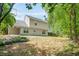 This home boasts a spacious backyard with mature trees and a privacy fence at 182 Garden Manor Ct, Loganville, GA 30052