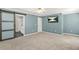 Spacious bedroom with a ceiling fan and sliding barn door to the bathroom at 182 Garden Manor Ct, Loganville, GA 30052