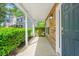 Charming covered front porch with stone accent wall and well-maintained landscaping at 182 Garden Manor Ct, Loganville, GA 30052
