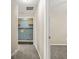 Hallway view showcasing a laundry room and bedroom at 182 Garden Manor Ct, Loganville, GA 30052