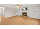 Bright living room boasts hardwood floors, a fireplace, and built-in shelving units for stylish storage and display at 182 Garden Manor Ct, Loganville, GA 30052