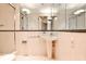 Clean bathroom features a shower stall, pedestal sink, and a large mirror enhancing the sense of space at 2121 Ponce De Leon Ne Ave, Atlanta, GA 30307
