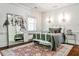 Cozy bedroom with hardwood floors, decorative chandelier, and a large mirror adding visual space at 2121 Ponce De Leon Ne Ave, Atlanta, GA 30307