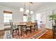 Dining room with hardwood floors, neutral walls, area rug, and modern lighting fixtures at 2121 Ponce De Leon Ne Ave, Atlanta, GA 30307
