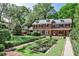 Brick home with lush landscaping, a pond and a gazebo at 2121 Ponce De Leon Ne Ave, Atlanta, GA 30307