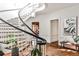 Stunning foyer with a sweeping staircase, showcasing hardwood floors and stylish decor at 2121 Ponce De Leon Ne Ave, Atlanta, GA 30307