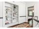 Hallway with built-in bookcase and view into a bedroom at 2121 Ponce De Leon Ne Ave, Atlanta, GA 30307