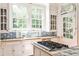 Bright kitchen with custom tile, modern appliances, and views of the backyard at 2121 Ponce De Leon Ne Ave, Atlanta, GA 30307