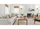 Bright living room with a fireplace, white molding and neutral decor, perfect for relaxing and entertaining at 2121 Ponce De Leon Ne Ave, Atlanta, GA 30307