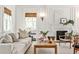 Inviting living room with a cozy fireplace, elegant decor, and ample natural light at 2121 Ponce De Leon Ne Ave, Atlanta, GA 30307