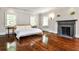 Spacious bedroom with hardwood floors, fireplace, and natural light at 2121 Ponce De Leon Ne Ave, Atlanta, GA 30307