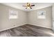 Bright bedroom with luxury vinyl floors and a ceiling fan at 2968 Cleburne Pkwy, Powder Springs, GA 30127