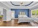 Bright and airy bedroom featuring hardwood floors, trey ceiling, and outdoor access at 3012 Keeneland Blvd, Mcdonough, GA 30252