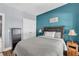Comfortable bedroom with a plush bed, accent wall, and plenty of closet space at 3012 Keeneland Blvd, Mcdonough, GA 30252