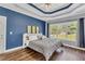 Beautiful bedroom featuring hardwood floors, a trey ceiling, and natural light at 3012 Keeneland Blvd, Mcdonough, GA 30252