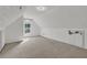 Well-lit bonus room featuring an arched window, soft carpeting, and ample wall space at 3012 Keeneland Blvd, Mcdonough, GA 30252