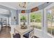 Charming breakfast nook with bay windows and white wainscoting overlooking a green backyard at 3012 Keeneland Blvd, Mcdonough, GA 30252