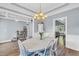 Dining room featuring a chandelier and wainscoting for an elegant touch at 3012 Keeneland Blvd, Mcdonough, GA 30252