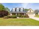 Charming single Gathering home with brick facade, manicured landscaping, and a two-car garage at 3012 Keeneland Blvd, Mcdonough, GA 30252