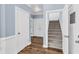 Hallway with hardwood floors and stairs at 3012 Keeneland Blvd, Mcdonough, GA 30252