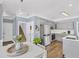 Kitchen and breakfast nook featuring gray cabinets, stainless steel appliances and backyard views at 3012 Keeneland Blvd, Mcdonough, GA 30252