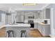 Kitchen featuring stainless steel appliances, gray cabinets and a breakfast bar with seating at 3012 Keeneland Blvd, Mcdonough, GA 30252