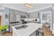 Spacious kitchen with stainless steel appliances and center island, open to the breakfast nook at 3012 Keeneland Blvd, Mcdonough, GA 30252