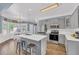 Modern kitchen with stainless steel appliances and a center island with barstool seating at 3012 Keeneland Blvd, Mcdonough, GA 30252