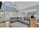 Bright living room with vaulted ceiling, fireplace and adjacent doors to a backyard deck at 3012 Keeneland Blvd, Mcdonough, GA 30252