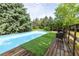 Private backyard pool with deck, surrounded by lush greenery, perfect for summer fun at 3012 Keeneland Blvd, Mcdonough, GA 30252