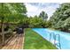 Beautiful pool with a wooden deck for relaxing, providing a private outdoor oasis at 3012 Keeneland Blvd, Mcdonough, GA 30252
