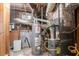 Basement utility area featuring water heater and furnace at 3664 Satellite Ter, Ellenwood, GA 30294