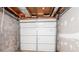 Unfinished basement garage space with a solid garage door at 3664 Satellite Ter, Ellenwood, GA 30294
