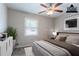 A virtually staged bedroom features a bed, dresser, and plant at 3664 Satellite Ter, Ellenwood, GA 30294