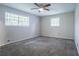 Bedroom with carpet, two windows, and a ceiling fan at 3664 Satellite Ter, Ellenwood, GA 30294