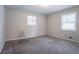 Bedroom with two windows and carpet at 3664 Satellite Ter, Ellenwood, GA 30294